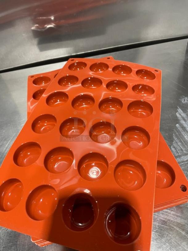 Silikomart 24-cup round non-stick silicone moulds, new. Durable, commercial-grade orange silicone with smooth finish.