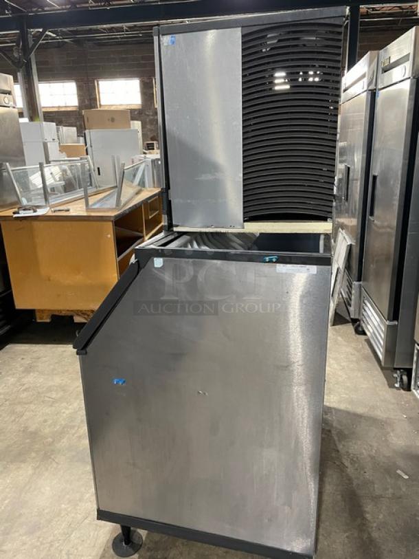 Manitowoc stainless steel ice machine, model ID0892N261, with storage bin, electric, 208-230V, on legs, in good condition.