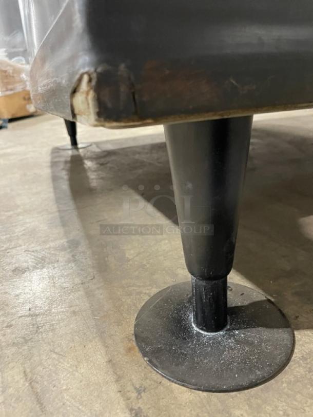 Manitowoc ID0892N261 ice machine on legs, showing minor wear on bottom edge.