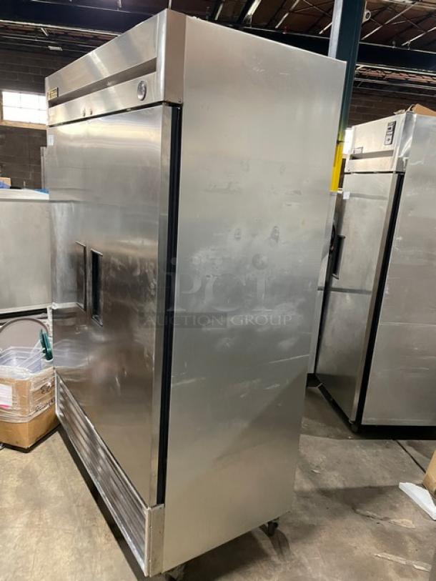 True T49 commercial stainless steel 2-door refrigerator, on casters, with poly-coated wire racks. Model T-49, SN: 1-2309201, 115V 1 Phase.
