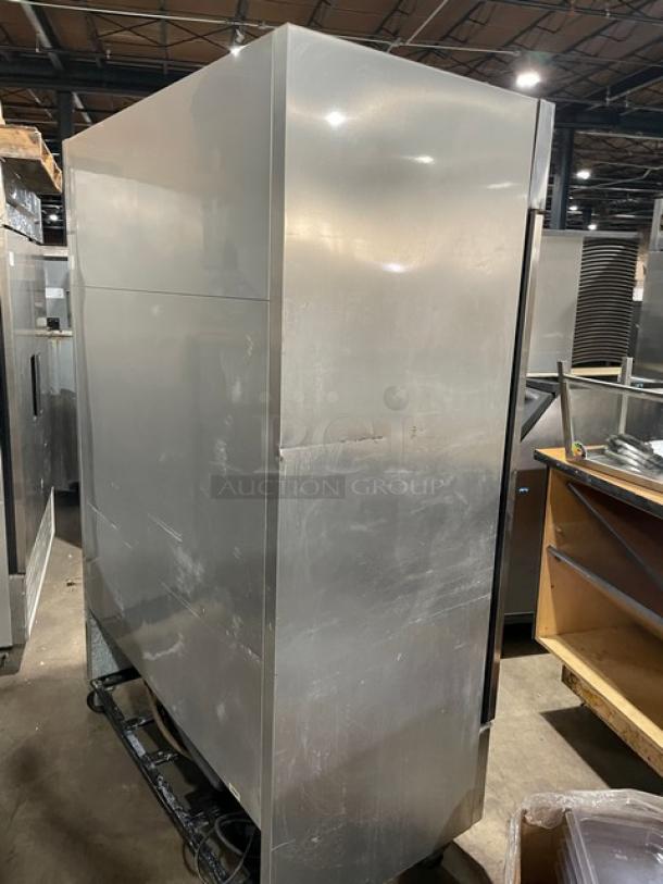True T-49 Commercial Stainless Steel 2 Door Refrigerator with poly coated racks and casters, model T49, SN: 1-2309201.