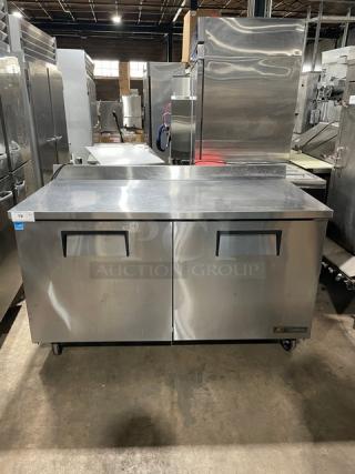 True TWT-60 stainless steel 2-door worktop refrigerator with backsplash, poly-coated racks, and casters. Energy Star certified.