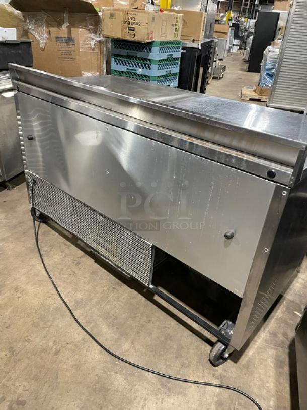 True TWT-60 commercial stainless steel 2-door worktop refrigerator, Energy Star certified, with backsplash and casters.