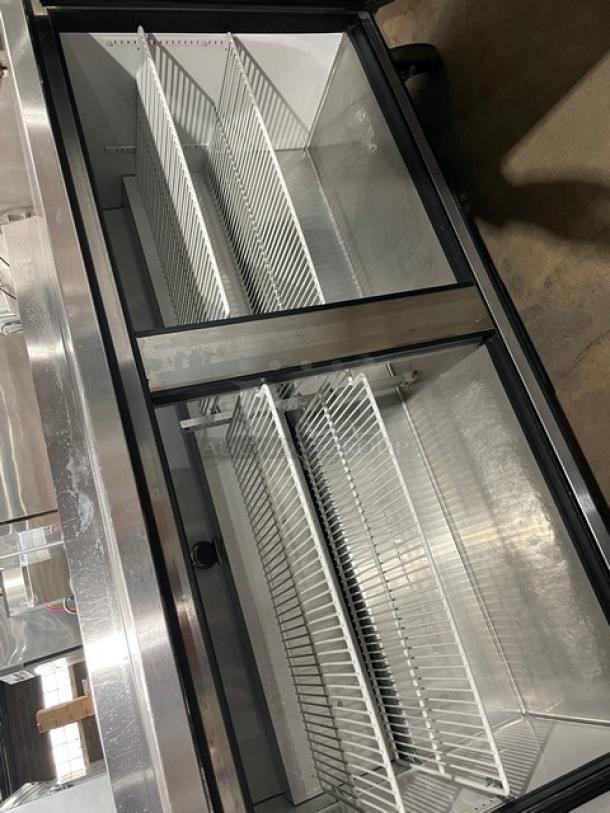 True TWT-60 stainless steel 2-door worktop refrigerator with backsplash and poly-coated wire racks. Energy Star certified.