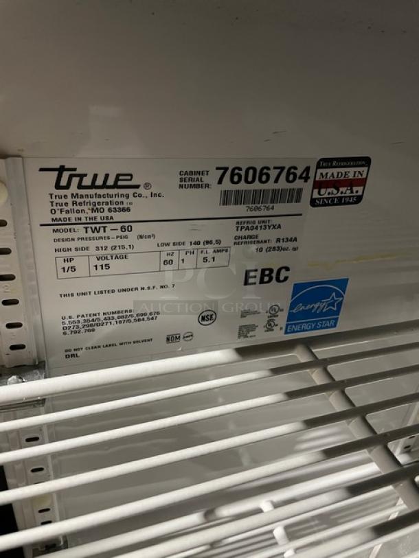 True TWT-60 commercial stainless steel 2-door worktop refrigerator, Energy Star certified, with backsplash and poly coated rack. Serial number 7606764, 115V, on casters.