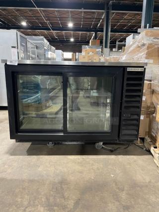 Beverage-Air black double glass sliding door merchandiser with stainless steel worktop, poly-coated racks, Model BB58HC1FGSBALT.