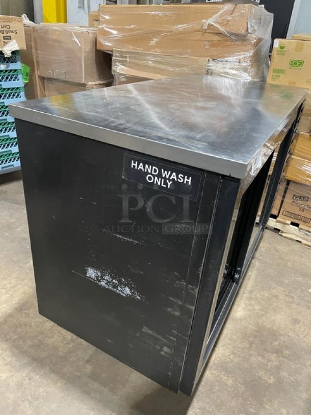 Beverage-Air black double glass sliding door merchandiser, model BB58HC1FGSBALT, with stainless steel worktop and poly coated racks. "Hand Wash Only" label visible.