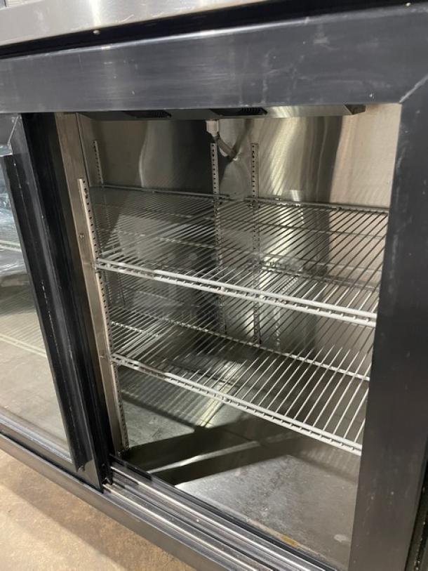 Beverage-Air double glass sliding door merchandiser, model BB58HC-1-F-GS-B-ALT, with stainless steel worktop and coated racks.