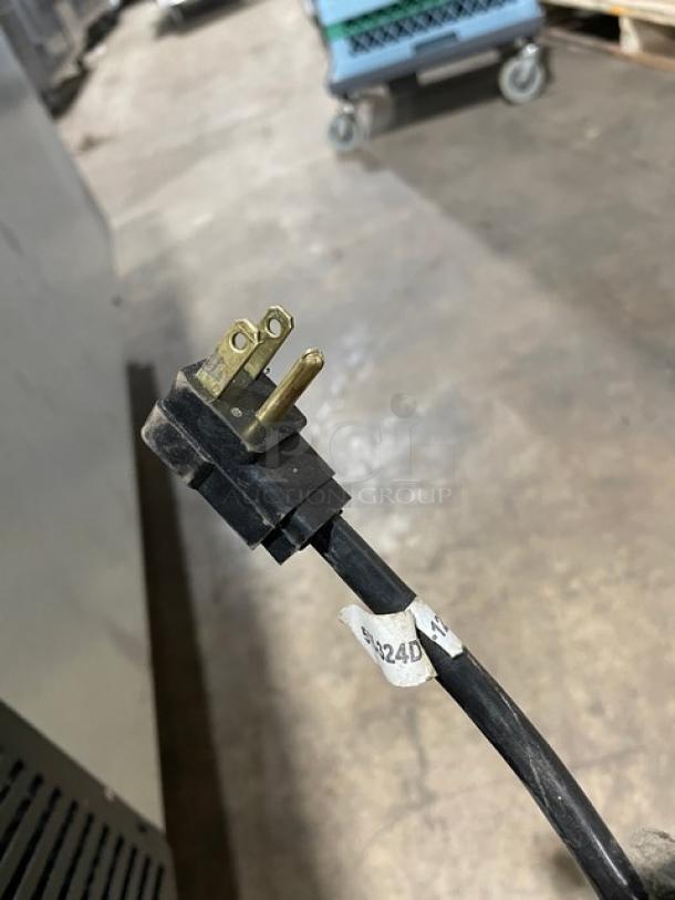 Power cord plug of Beverage-Air Commercial Merchandiser, Model BB58HC1FGSBALT, 115V, with visible label.