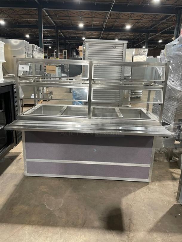 Atlas Metal stainless steel 4-well cold salad bar, Model WCMBT4, with sneeze guard, tray slide, and enclosed storage.