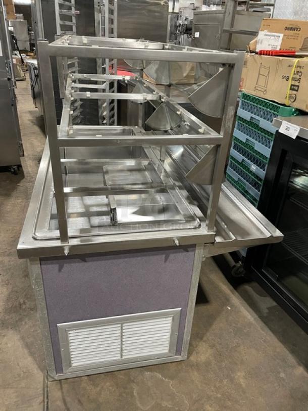 Atlas Metal stainless steel refrigerated 4-well salad bar with sneeze guard, tray slide, and enclosed storage, Model WCM-BT-4.