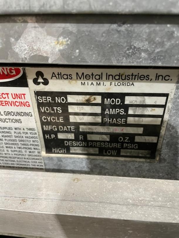 Atlas Metal WCMBT4 refrigerated salad bar, model WCM-BT-4, 4-well, sneeze guard, tray slide, storage below, on casters, 115V.