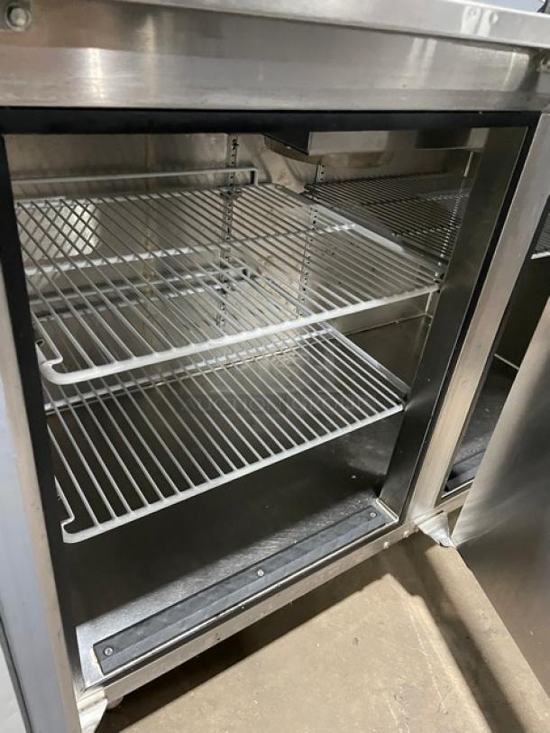 GlasTender stainless steel 2-door back bar cabinet with poly-coated racks, Model LP60L6SSLL, on legs. Serial: 134157454F.