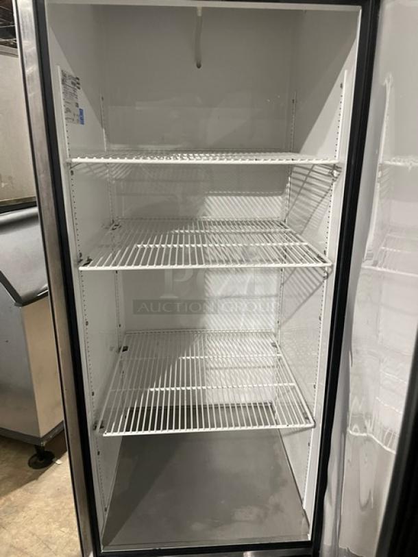 True T-23 single door stainless steel refrigerator, Energy Star certified, with poly coated wire racks and casters.