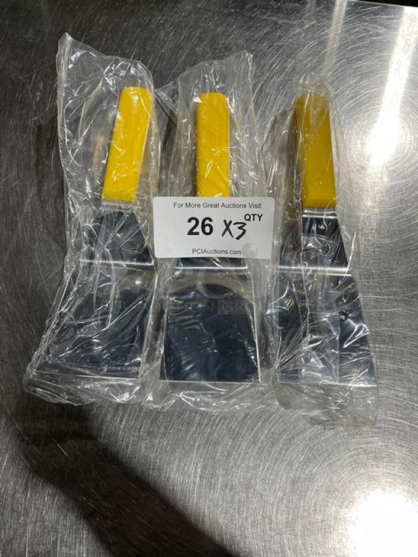 Dexter Russell Sani-Safe Series stainless steel hamburger turners, model S286-4, with yellow grip handles, new in packaging.