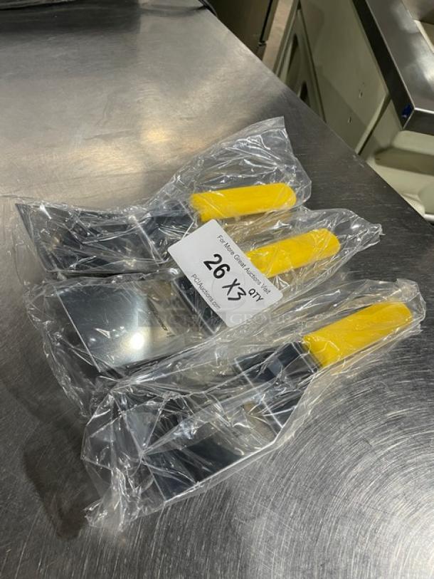 Dexter Russell Sani-Safe Hamburger Turner, Model S286-4, new, stainless steel, 4"x3" blade, yellow grip handle, in packaging.