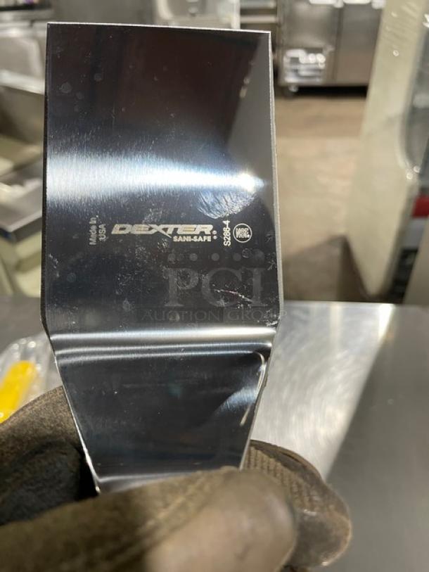 Brand new Dexter Russell Sani-Safe Series stainless steel hamburger turner, model S286-4, with yellow grip handle.