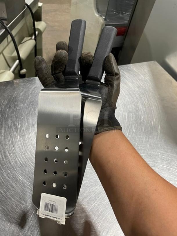 Brand new Dexter Russell P94857 stainless steel perforated 8"x3" cake turner with black grip handle, barcode tag visible.