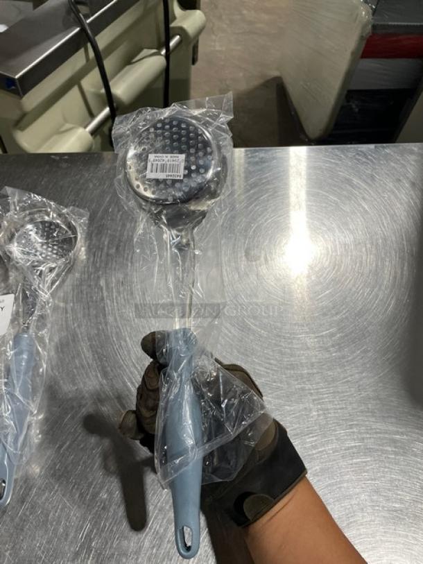 Brand new Vollrath Jacob's Pride 4 oz. stainless steel perforated spoodle, model 6432445, gray grip handle, packaging intact.