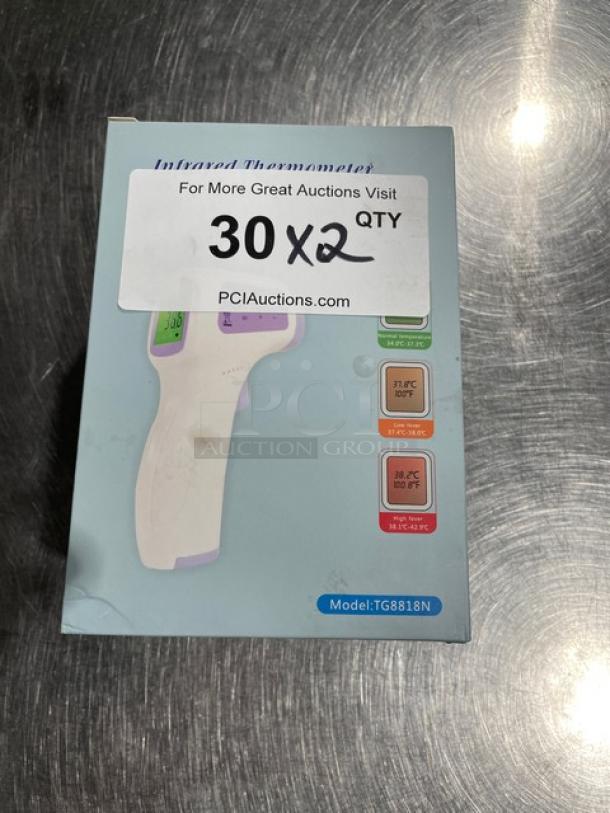 Brand new TG8818N non-contact forehead thermometer in box. Features temperature range display, model tag visible.