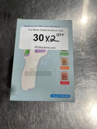 Brand new TG8818N non-contact forehead thermometer in box. Features temperature range display, model tag visible.