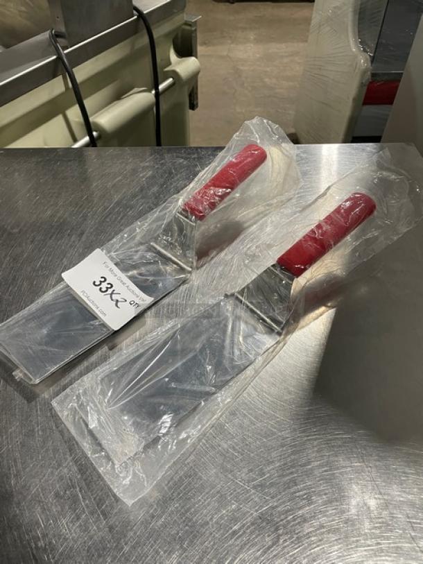 Dexter Russell 31989R turner, stainless steel, 8"x3" square edge, red grip handle, brand new in packaging, two units shown.
