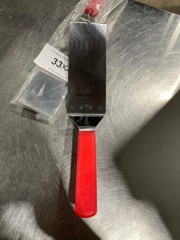 Dexter Russell Model 31989R 8" x 3" stainless steel turner with red grip handle, brand new condition, visible logo.