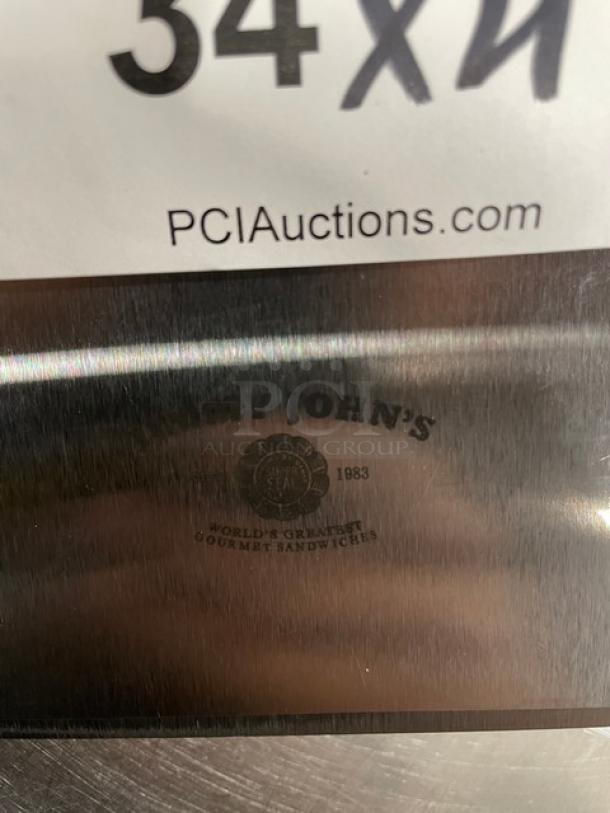 NEW Jimmy John's style stainless steel dough cutter with a white grip handle. Marked with Jimmy John's logo. Mint condition.
