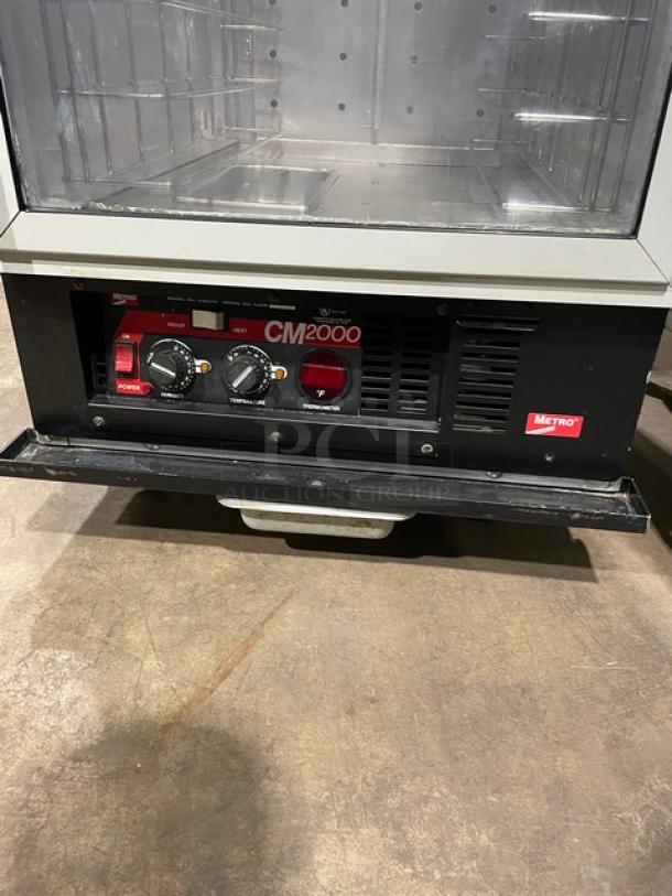 Metro FlavorView C175-CM2000 commercial heated holding/proofing cabinet with pan holding rack, 120V, on casters.