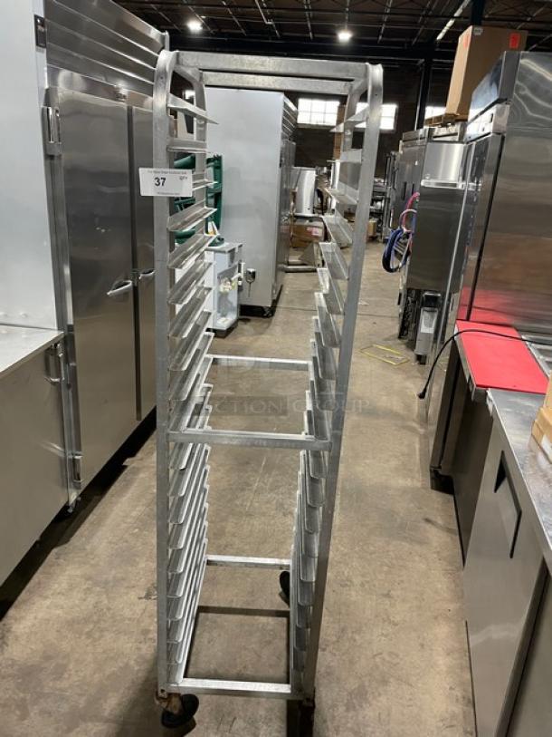 Commercial heavy-duty pan holding/transport rack on casters; metal construction; excellent condition; ID tag visible.