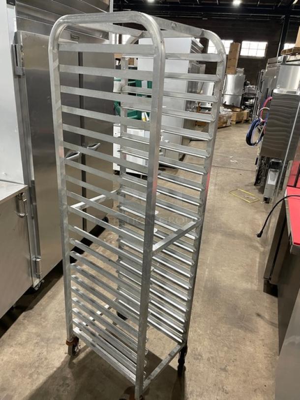 Commercial heavy-duty pan holding/transport rack with metal slats on casters; excellent condition, ideal for kitchens.