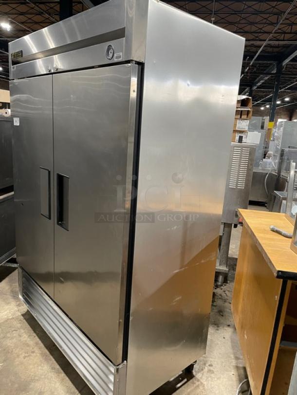 True T-49F commercial stainless steel 2-door reach-in freezer with poly-coated wired racks, on casters, 115V, 1 phase.