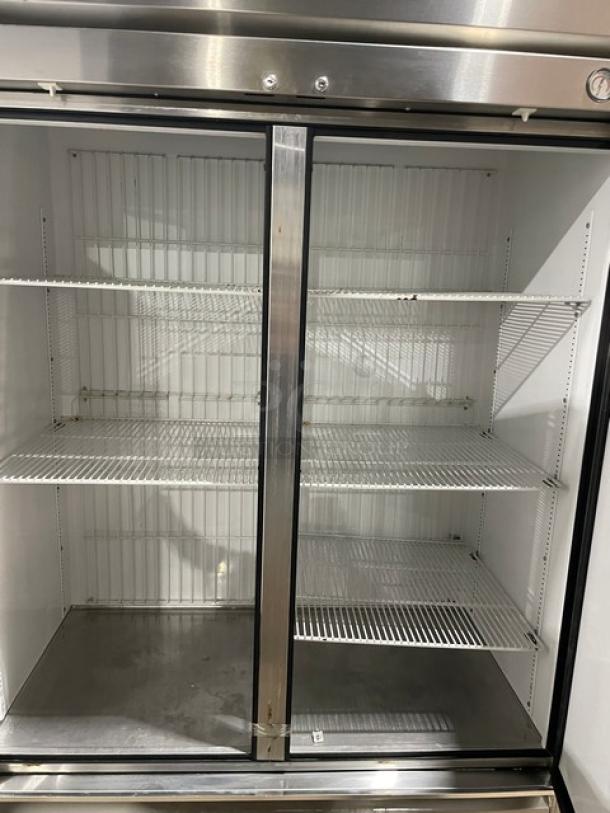 True T-49F Commercial Stainless Steel 2-Door Freezer on casters, with poly-coated wired racks, 115V, 1 phase, SN: 1-4032036.