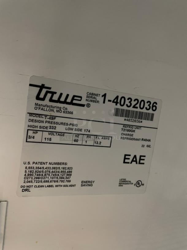 True commercial T-49F stainless steel 2-door reach-in freezer, model T-49F, SN: 1-4032036, on casters, with poly-coated wired racks. 115V, 1 Phase.
