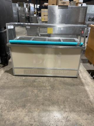 Atlas Metal stainless steel 4-well hot food steamtable with sneeze guard, tray slide, and casters, 208V 1 Phase, commercial use.