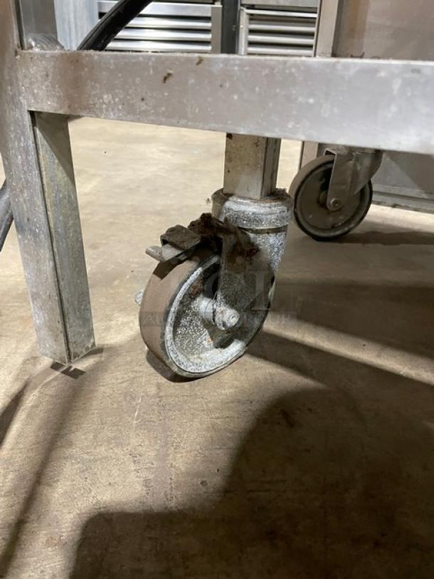 Atlas Metal stainless steel electric buffet steam table caster, showing wear, part of a 4-well mobile unit, 208V, 1 phase.