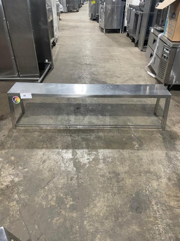 Commercial stainless steel serve-over sneeze guard, rectangular design. Clean, shiny surface, ideal for food service protection.