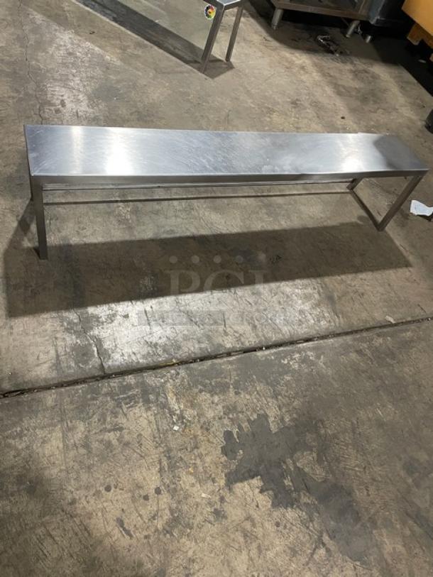 Commercial stainless steel sneeze guard, long rectangular design, durable construction, excellent condition.