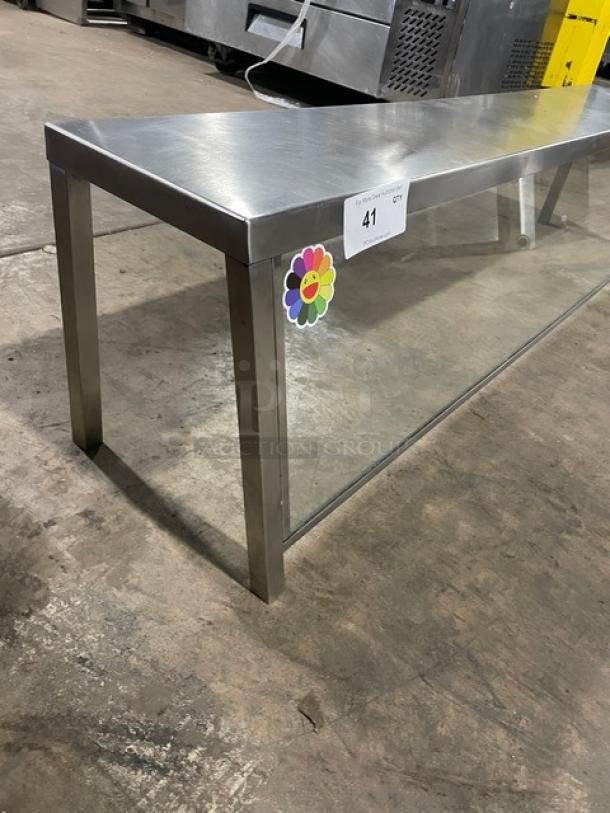 Commercial stainless steel serve over sneeze guard with glass, excellent condition, 4 legs, item tag number 41 attached.