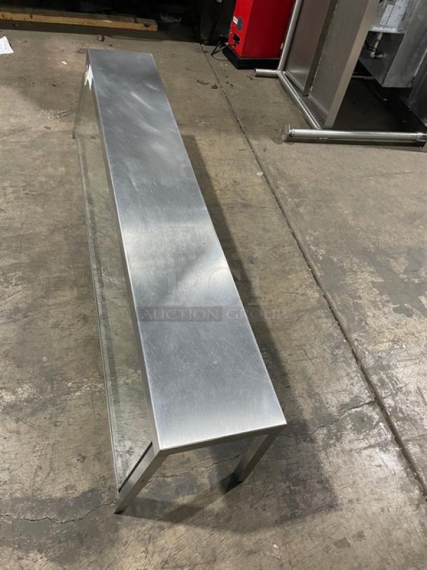 Commercial stainless steel serve-over sneeze guard, rectangular shape, good condition, features sturdy glass panels.