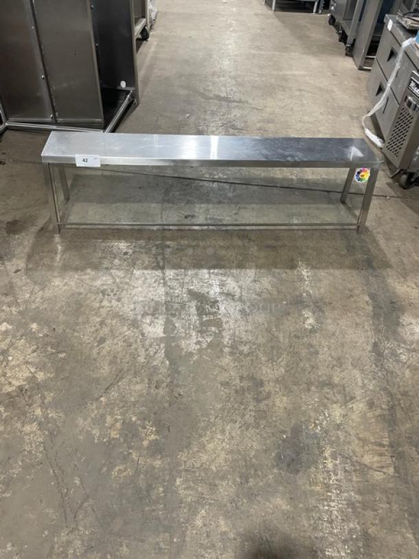 Commercial stainless steel sneeze guard, rectangular design, clear panels, excellent condition, visible label with number 42.