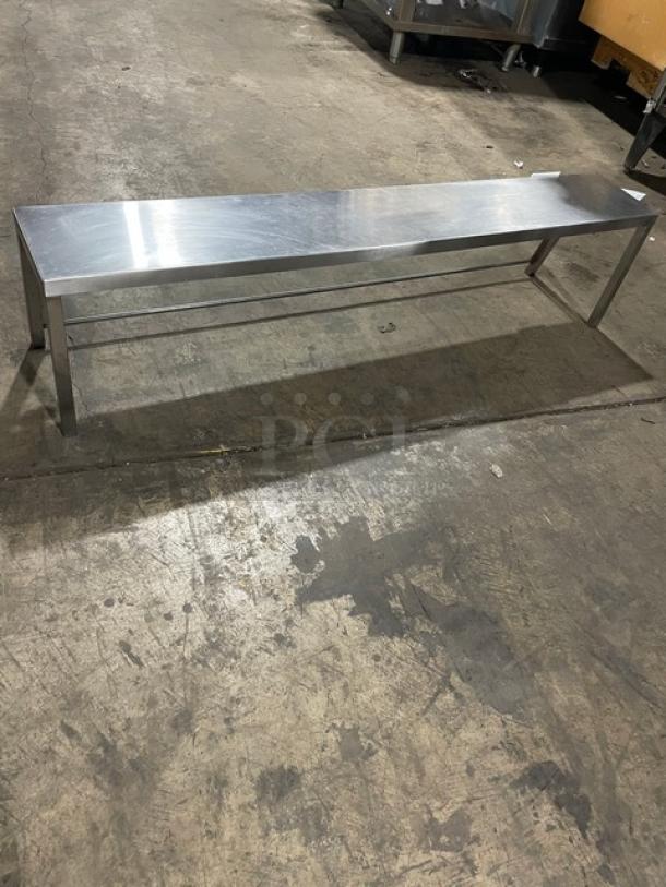 Commercial stainless steel serve over sneeze guard, long rectangular design, polished finish, excellent condition.