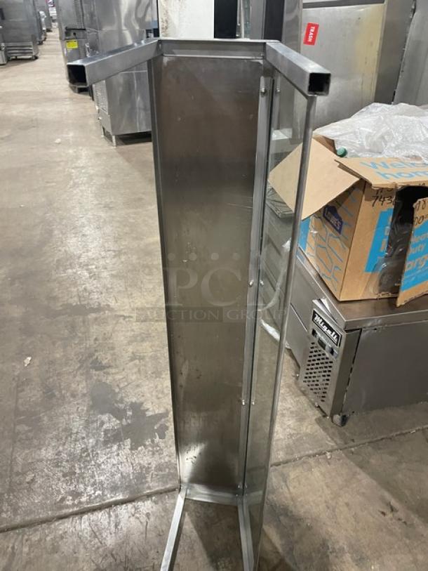 Commercial stainless steel sneeze guard, rectangular design, durable condition, for serving areas. Ideal for hygiene.