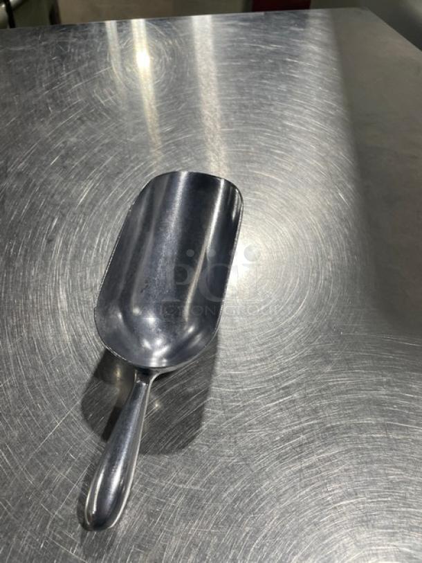 NEW Commercial Cast Aluminum 5 oz. Handheld Scoop, Model ASC-05, shown on metal surface. Excellent condition.