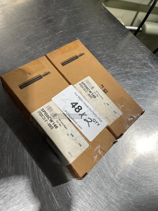 Box of Cambro Camwear Series white 8" salad spoons, model SPO8CW148, new condition, 12 per case, visible labels.