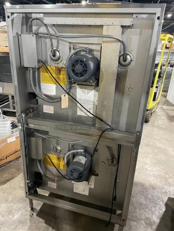 Blodgett stainless steel natural gas double-stacked convection oven, solid state thermostatic control, on legs, rear view.