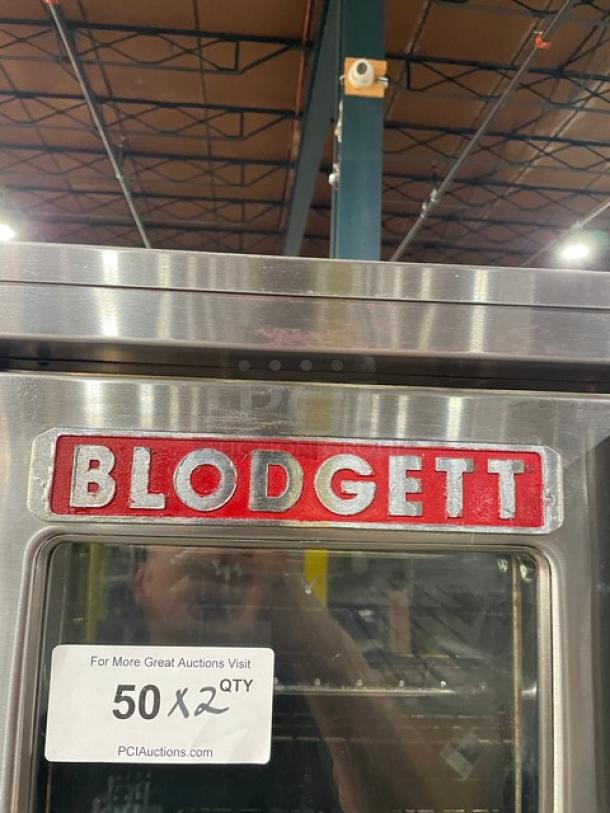 Blodgett double-stacked stainless steel convection oven, natural gas powered, with solid state thermostatic control and wired rack.