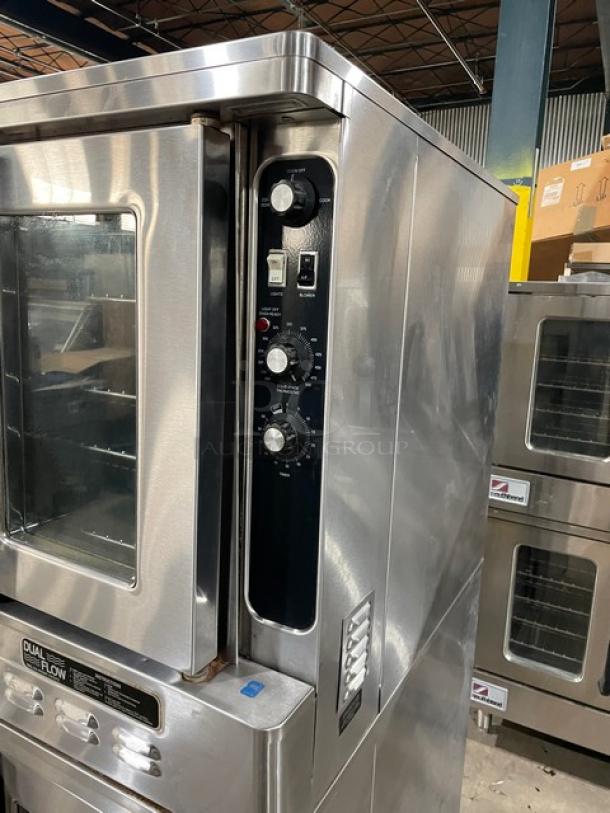 Blodgett stainless steel natural gas double-stacked convection oven with dual-flow design, solid state thermostatic control, and wired rack. Serial: 031203RA068T.