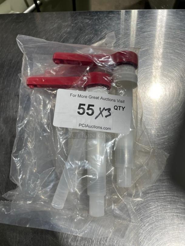 Brand new commercial condiment pump with red handles in sealed packaging, labeled "55 X3 QTY" from PCI Auctions.