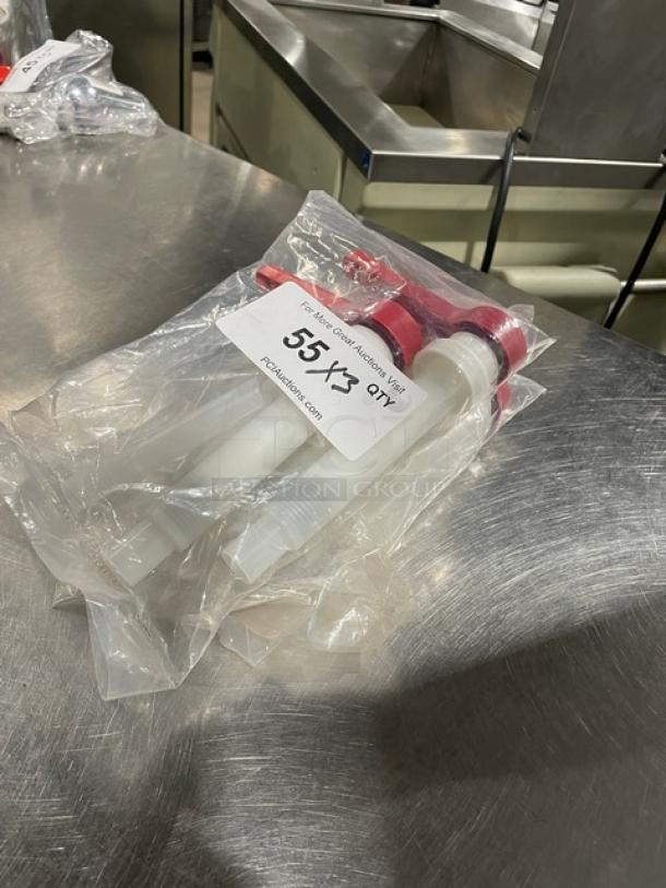 Brand new commercial red condiment pump, sealed in packaging. Label indicates set of three. Ideal for food service use.